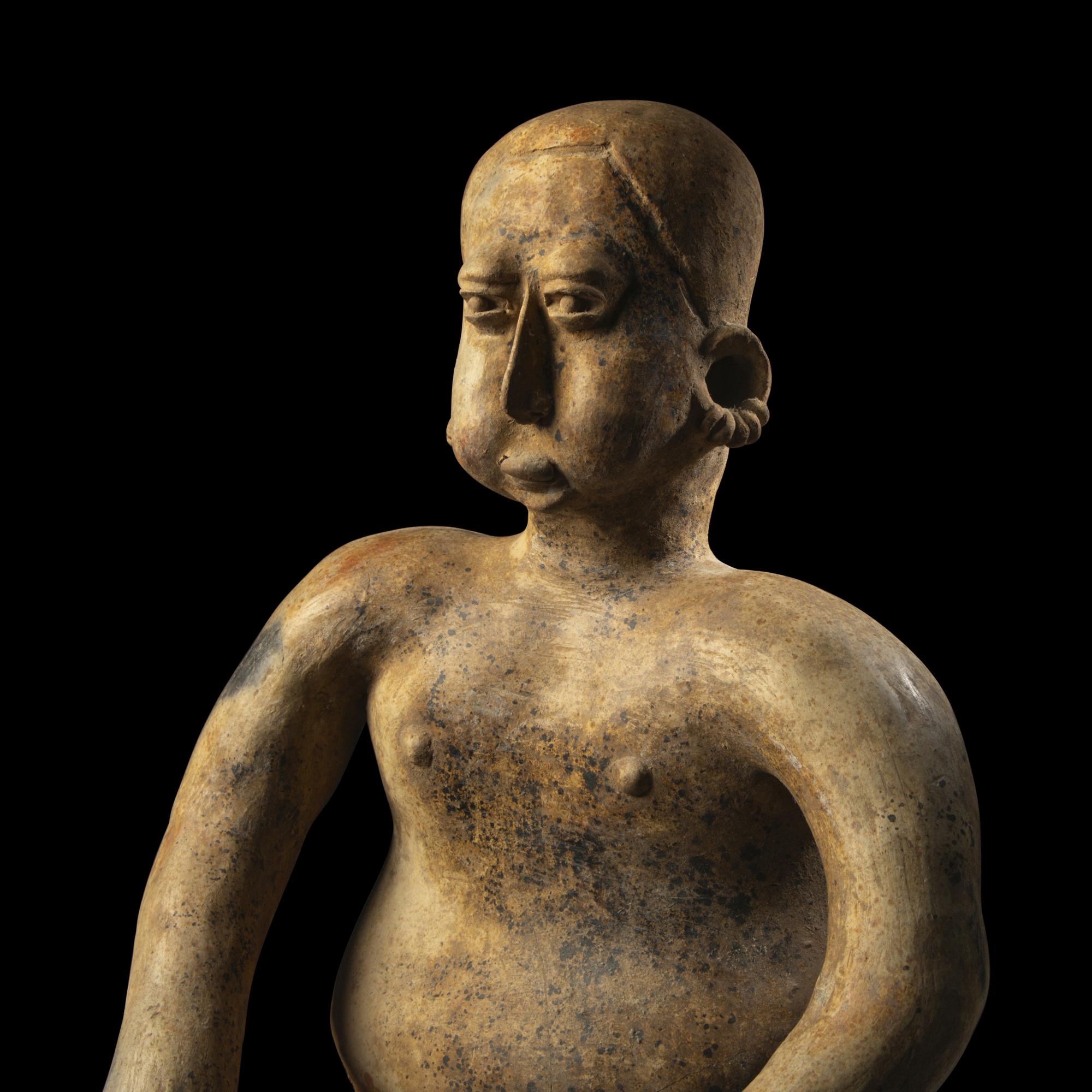 A Jalisco Terracotta Seated Male Figure