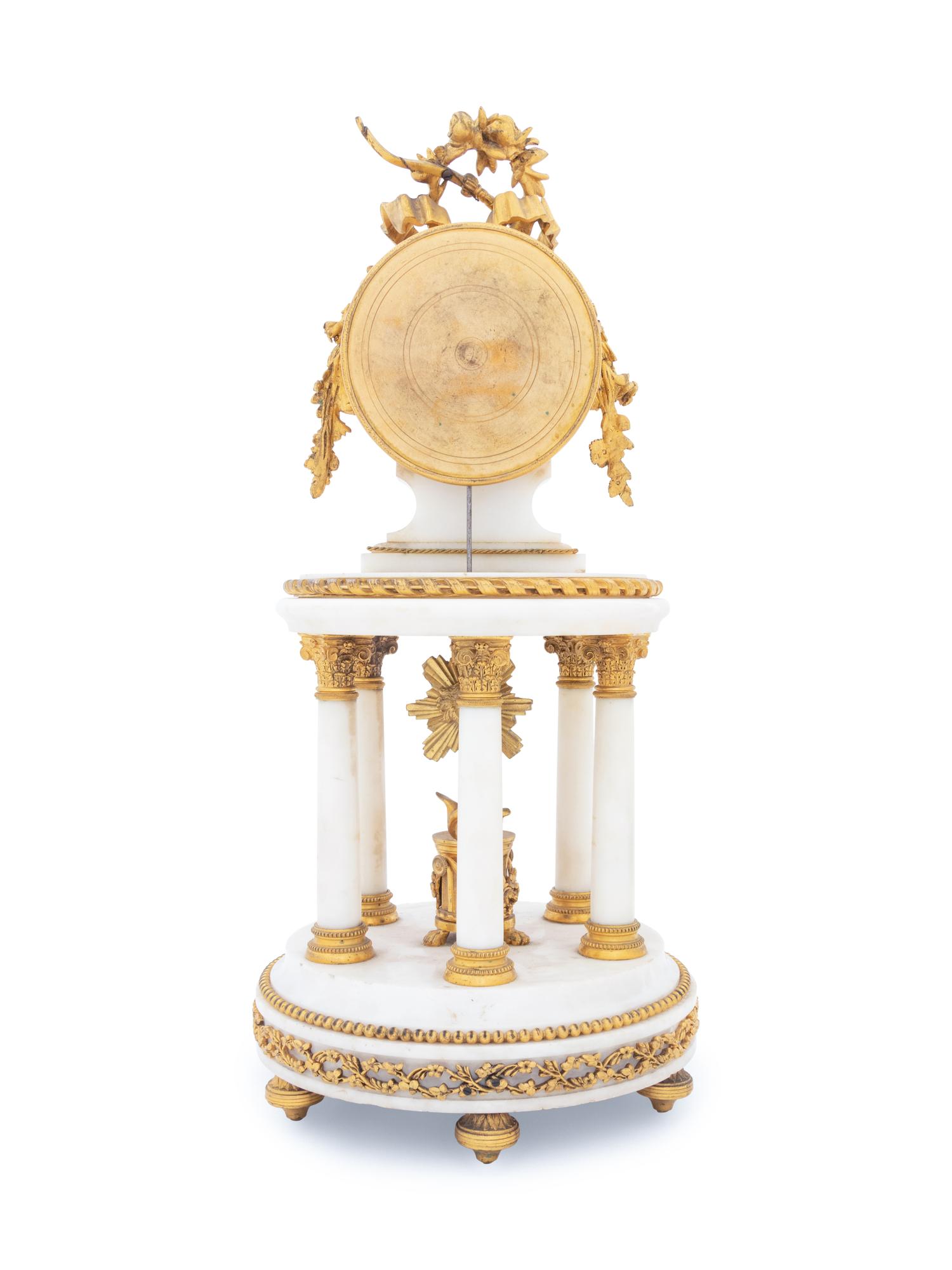A French Gilt Bronze Mounted Marble Portico Clock
