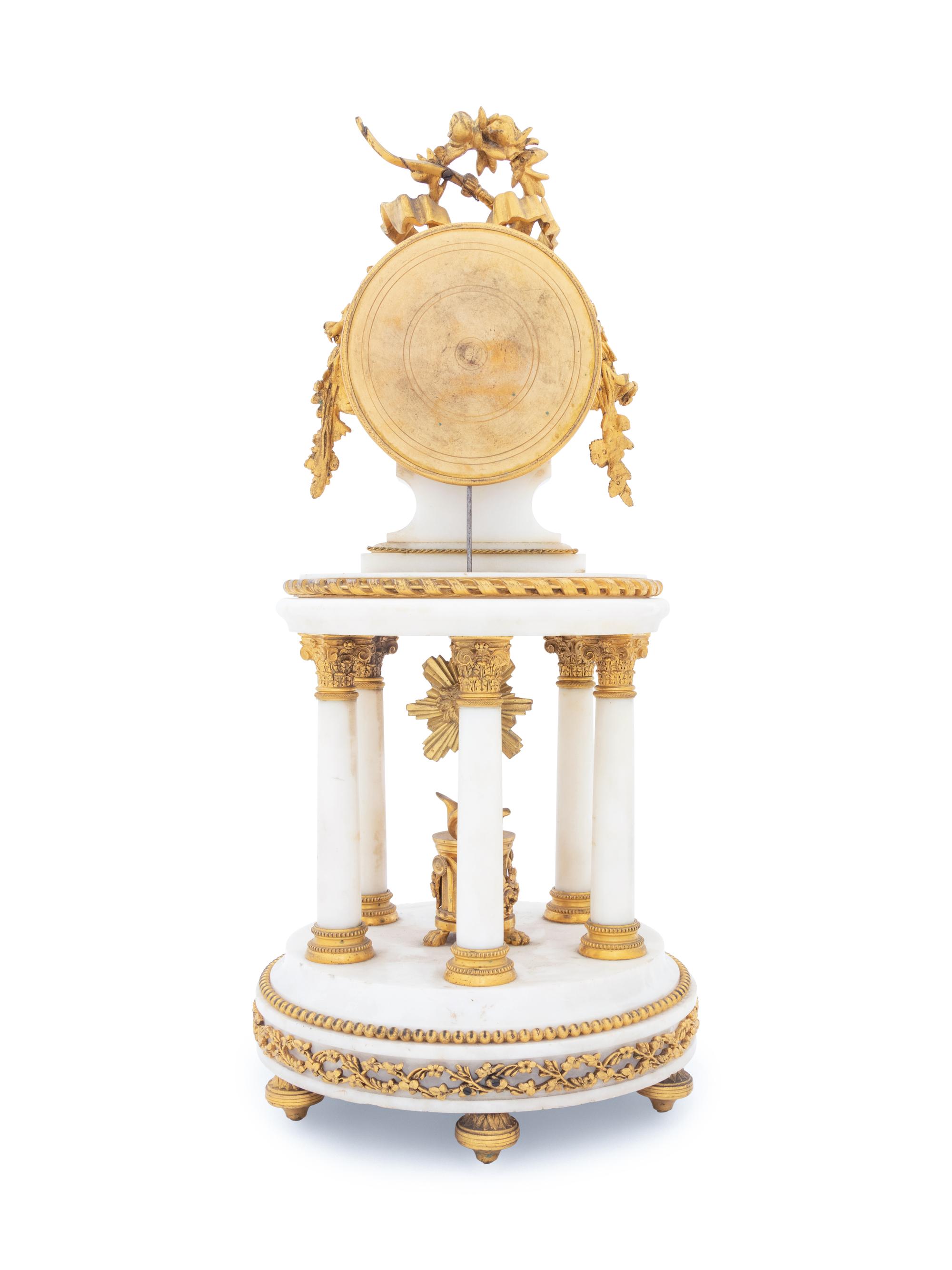 A French Gilt Bronze Mounted Marble Portico Clock
