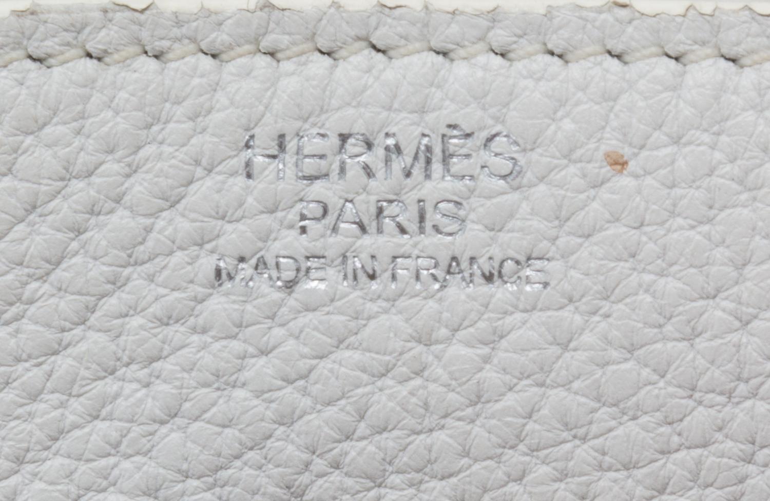 An Hermes White Taurillon Clemence Lindy 34 Handbag, 13.5" x 8" x 7".