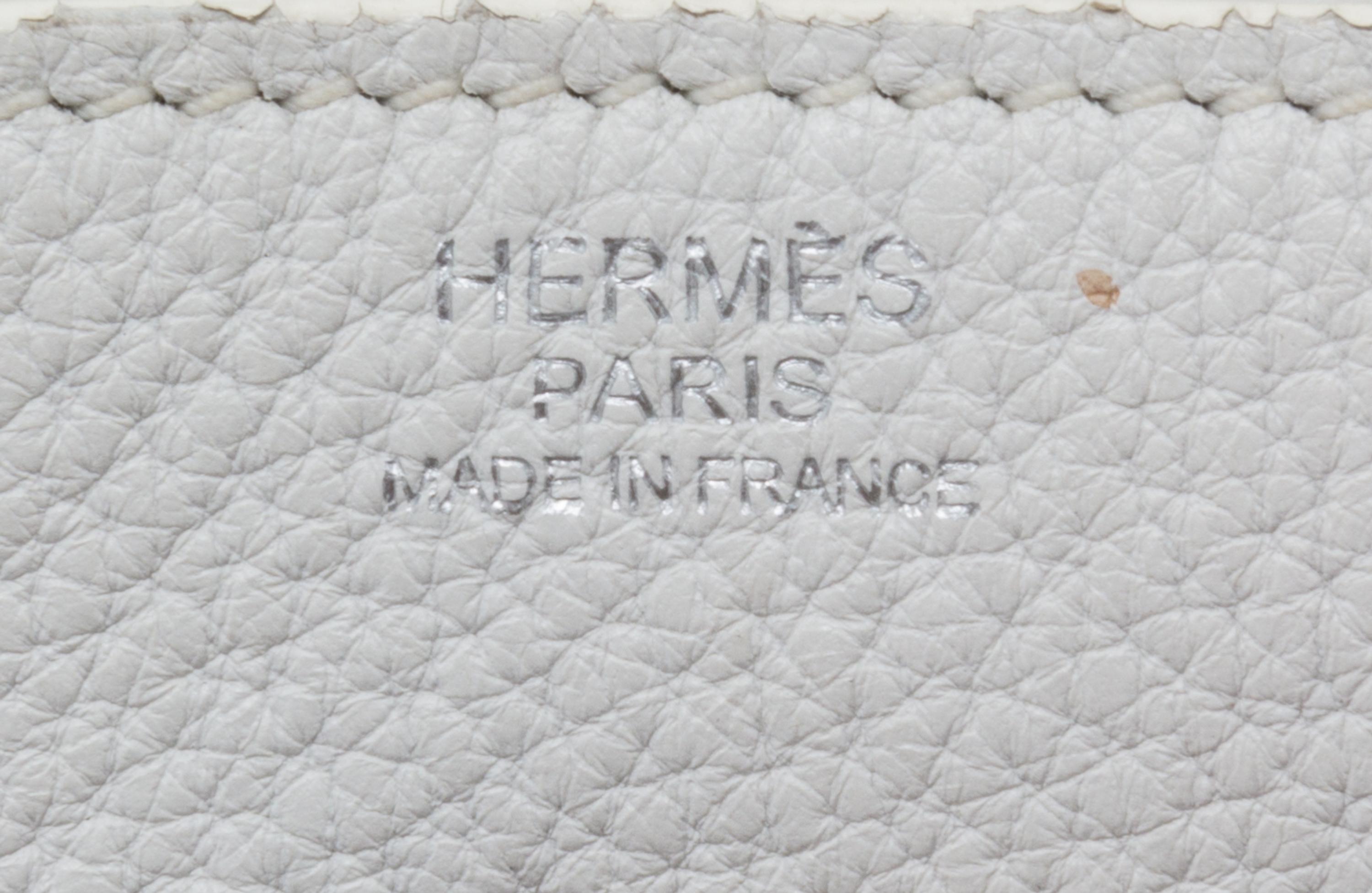 An Hermes White Taurillon Clemence Lindy 34 Handbag, 13.5" x 8" x 7".