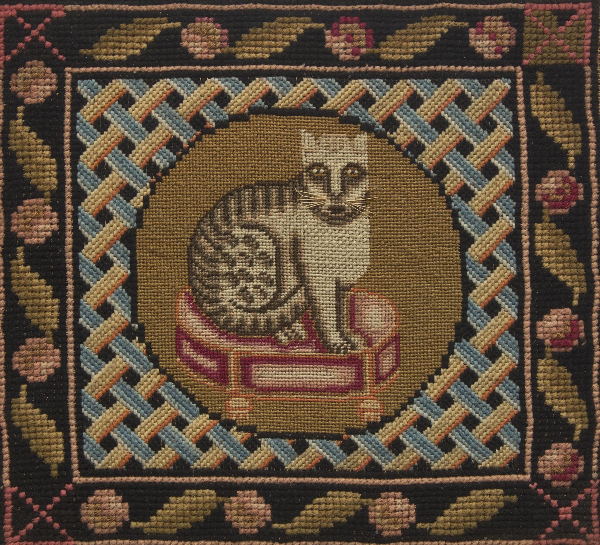 A Needlepoint Picture Depicting a Cat Seated on a Stool