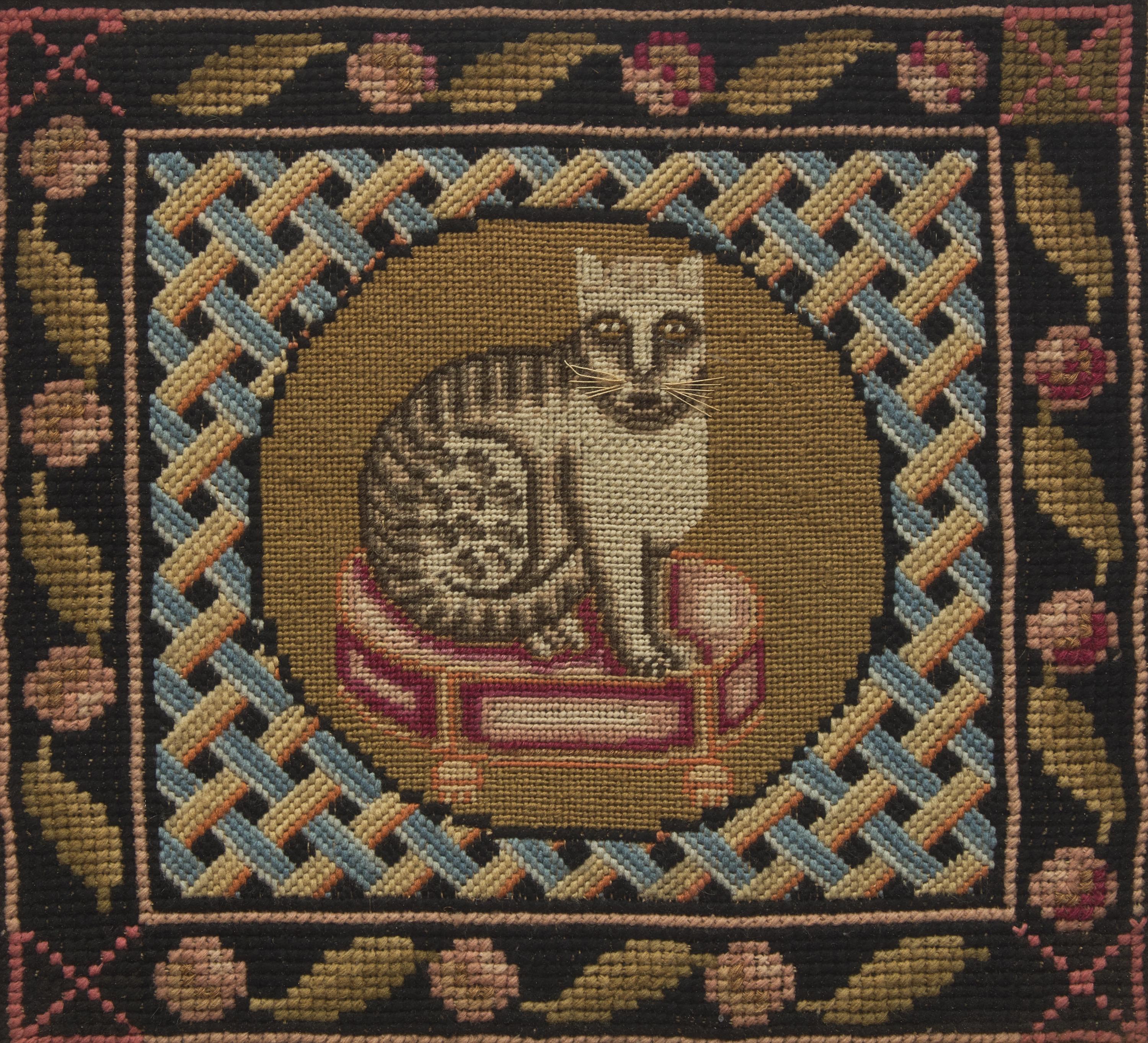 A Needlepoint Picture Depicting a Cat Seated on a Stool