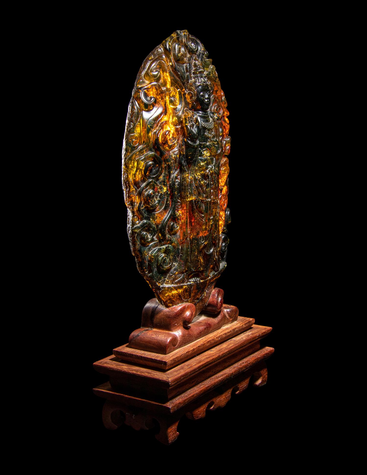 A Chinese Carved Amber Carving of Guanyin