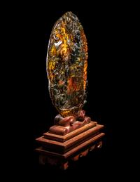 A Chinese Carved Amber Carving of Guanyin