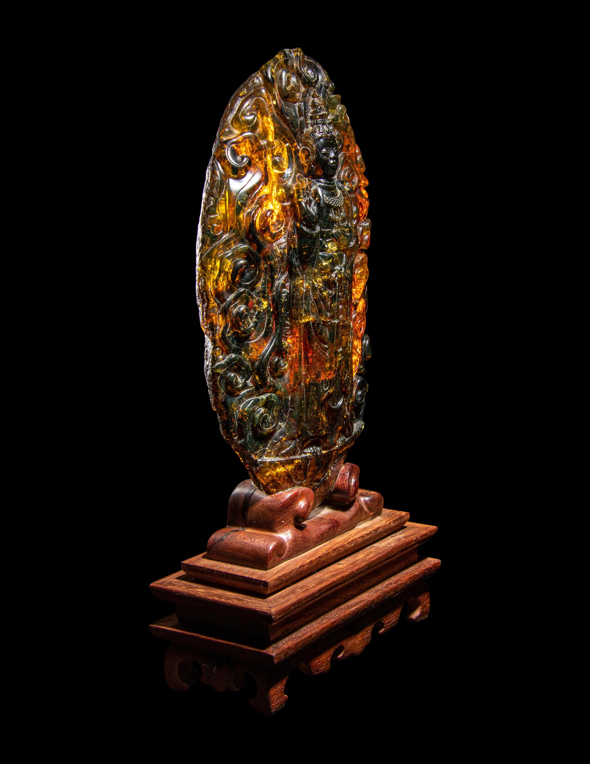 A Chinese Carved Amber Carving of Guanyin