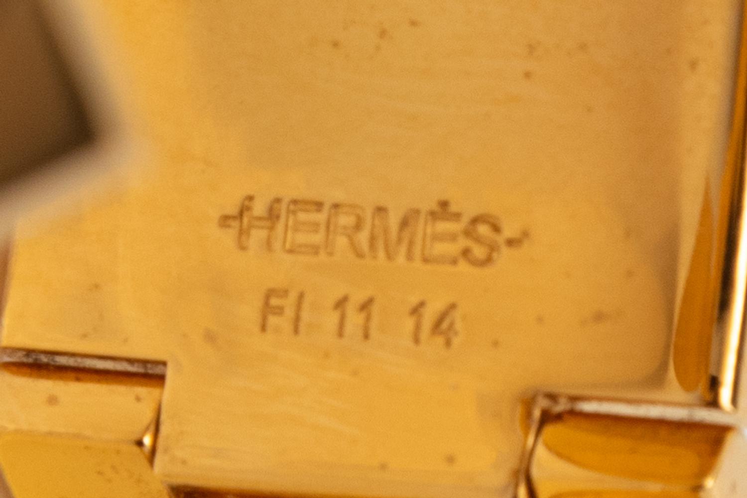 A Group of Three Costume Jewelry Pieces by Hermès and Chanel