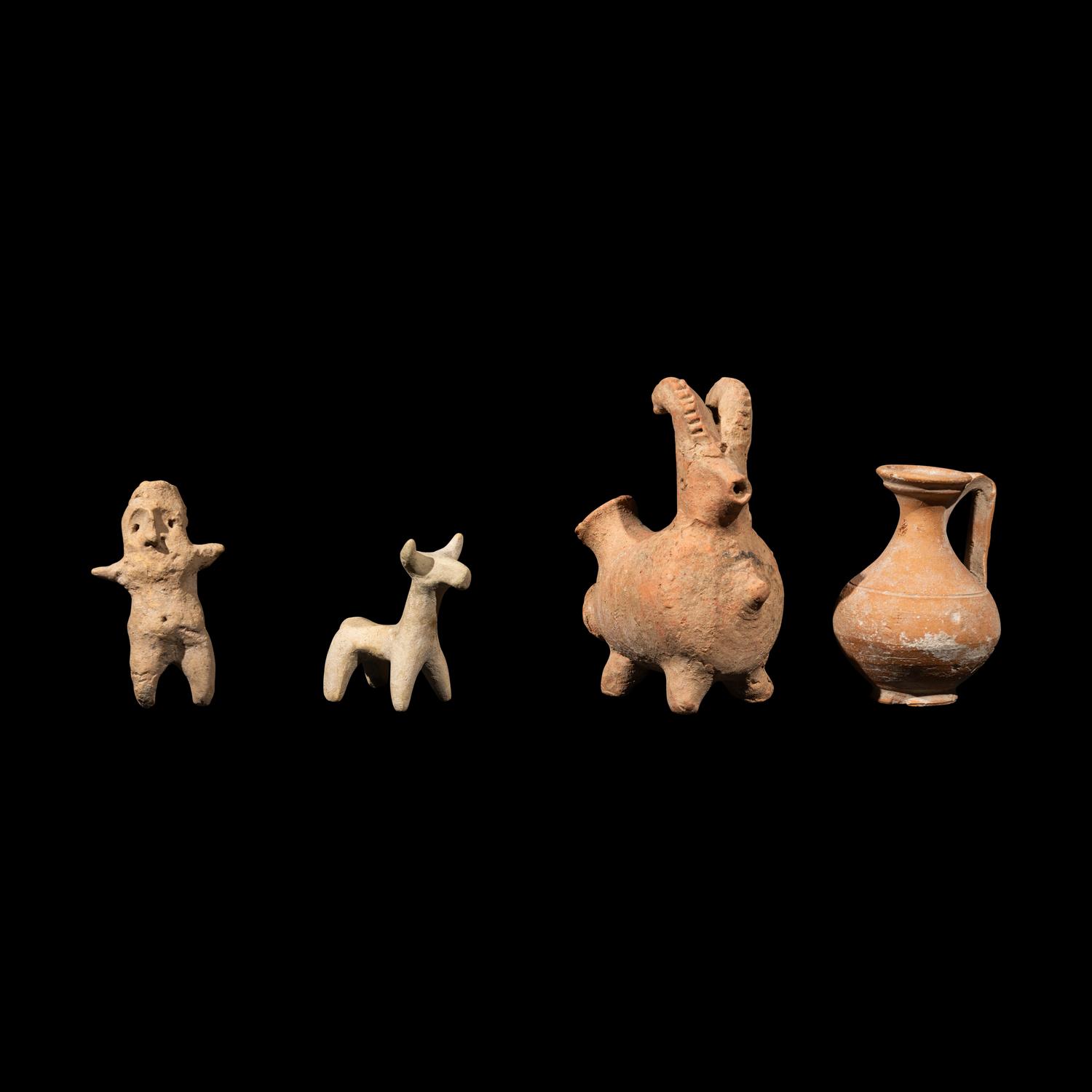 Eight Near Eastern Terracotta Figurines and Vessels