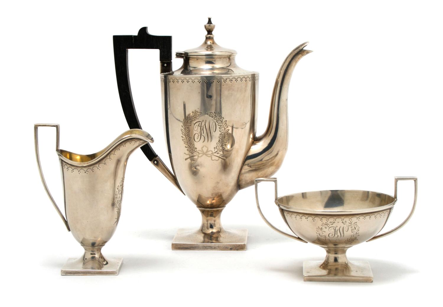 An American Sterling Silver Three Piece Tea Service, Height of first 6 7/8 inches.