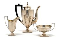 An American Sterling Silver Three Piece Tea Service, Height of first 6 7/8 inches.