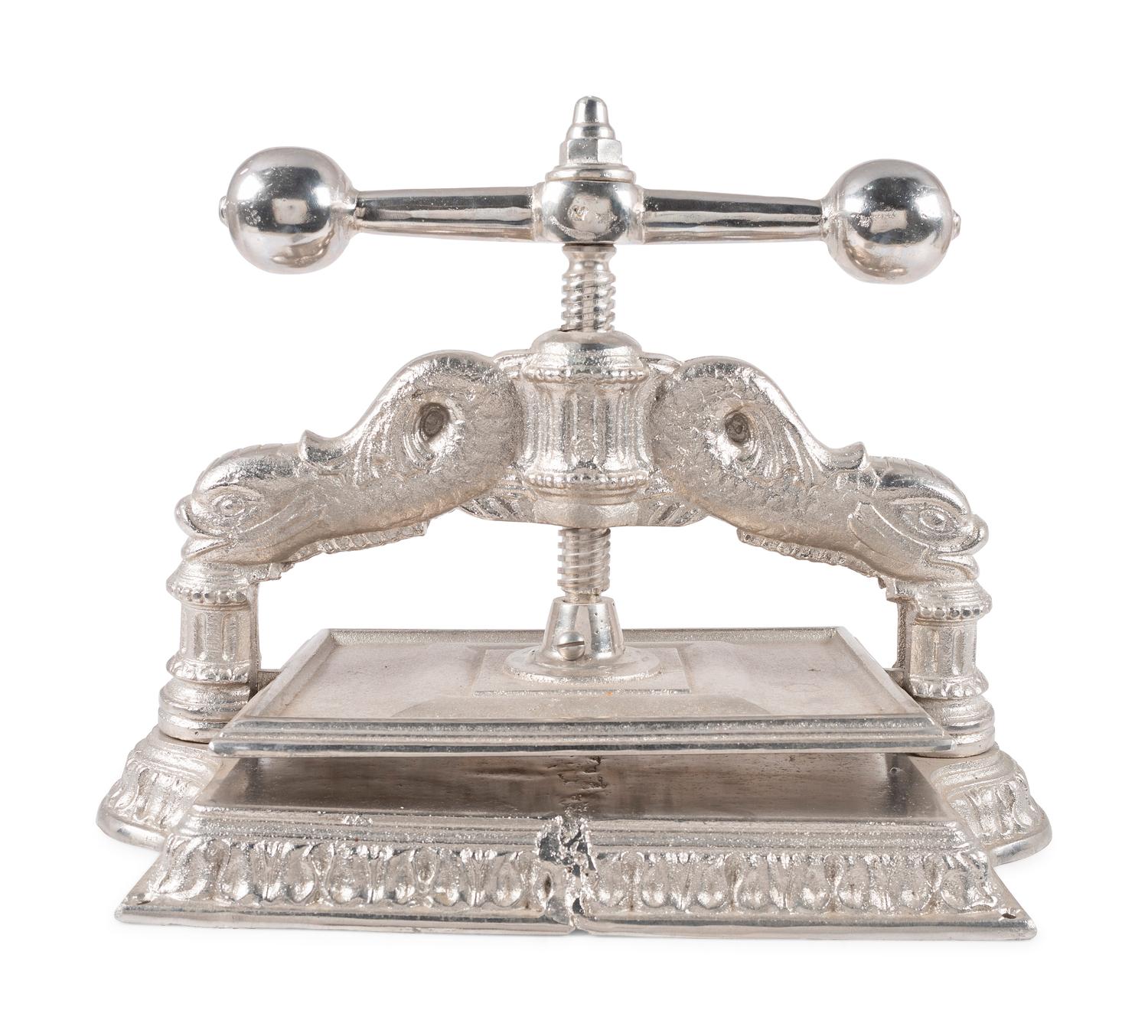 A Dolphin Form Silvered Metal Book Press