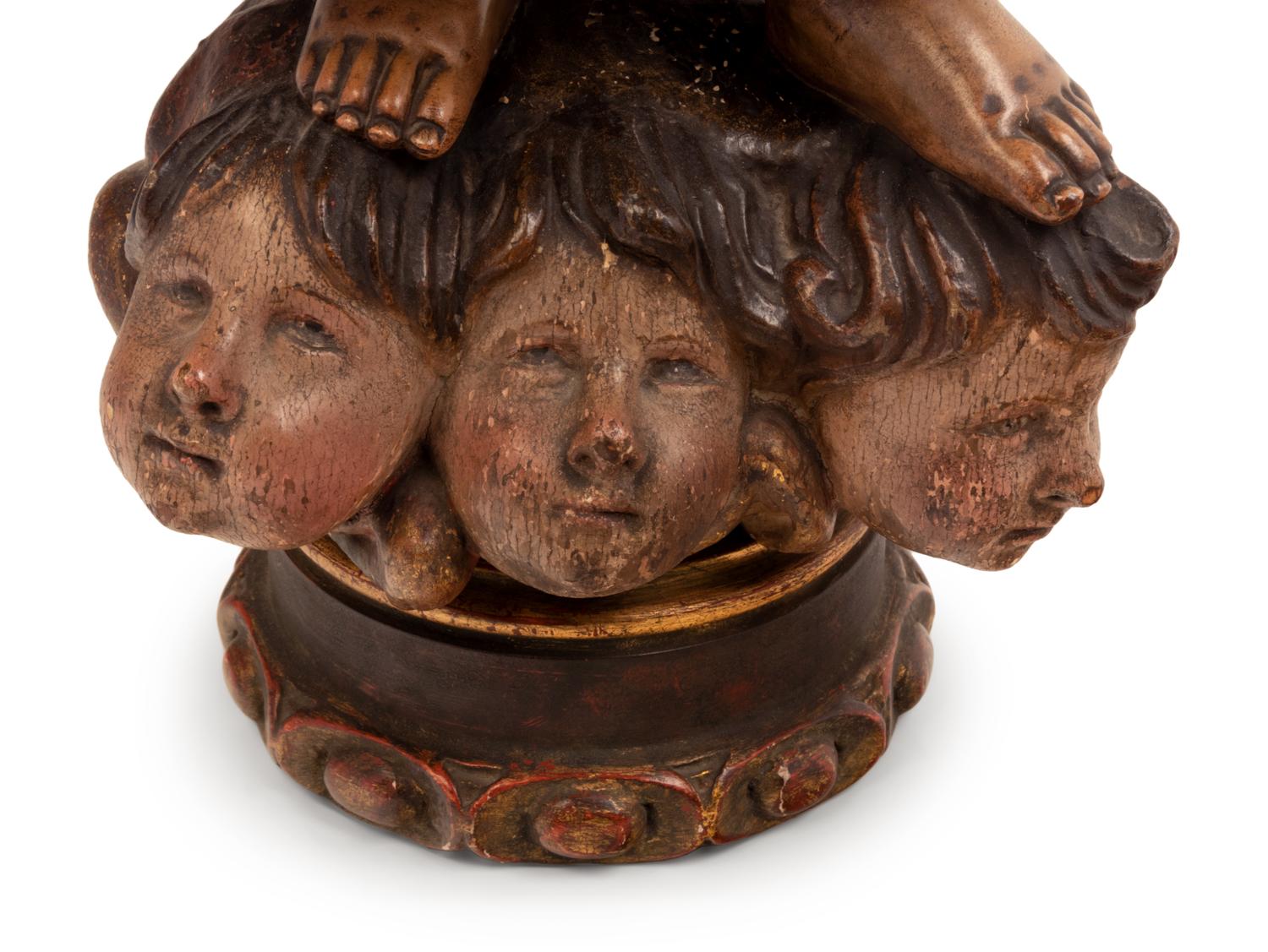 A Continental Parcel Gilt and Polychrome Decorated Putto