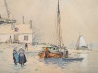 Windmill near a river with figures in the snow