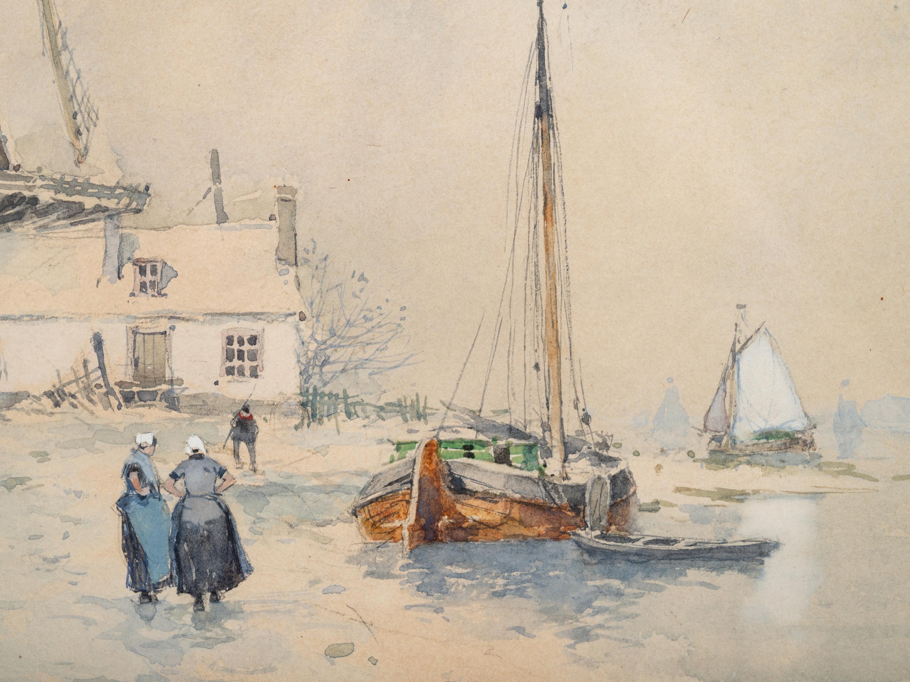 Windmill near a river with figures in the snow