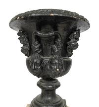 A Pair of Large Cast Iron Campagna-Form Jardinieres on Fossilized Coral Limestone Plinths
