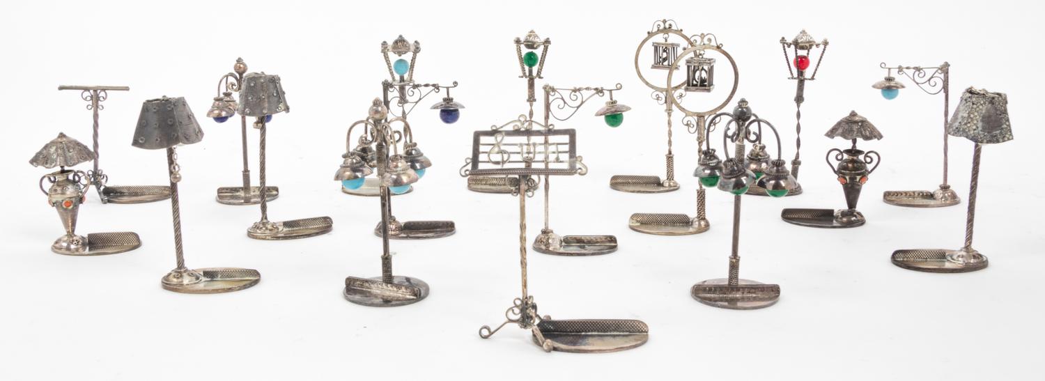 A Collection of 18 Italian Silver Place Card Holders Height 2 3/4 inches.