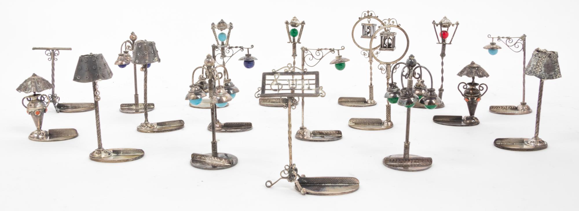 A Collection of 18 Italian Silver Place Card Holders Height 2 3/4 inches.