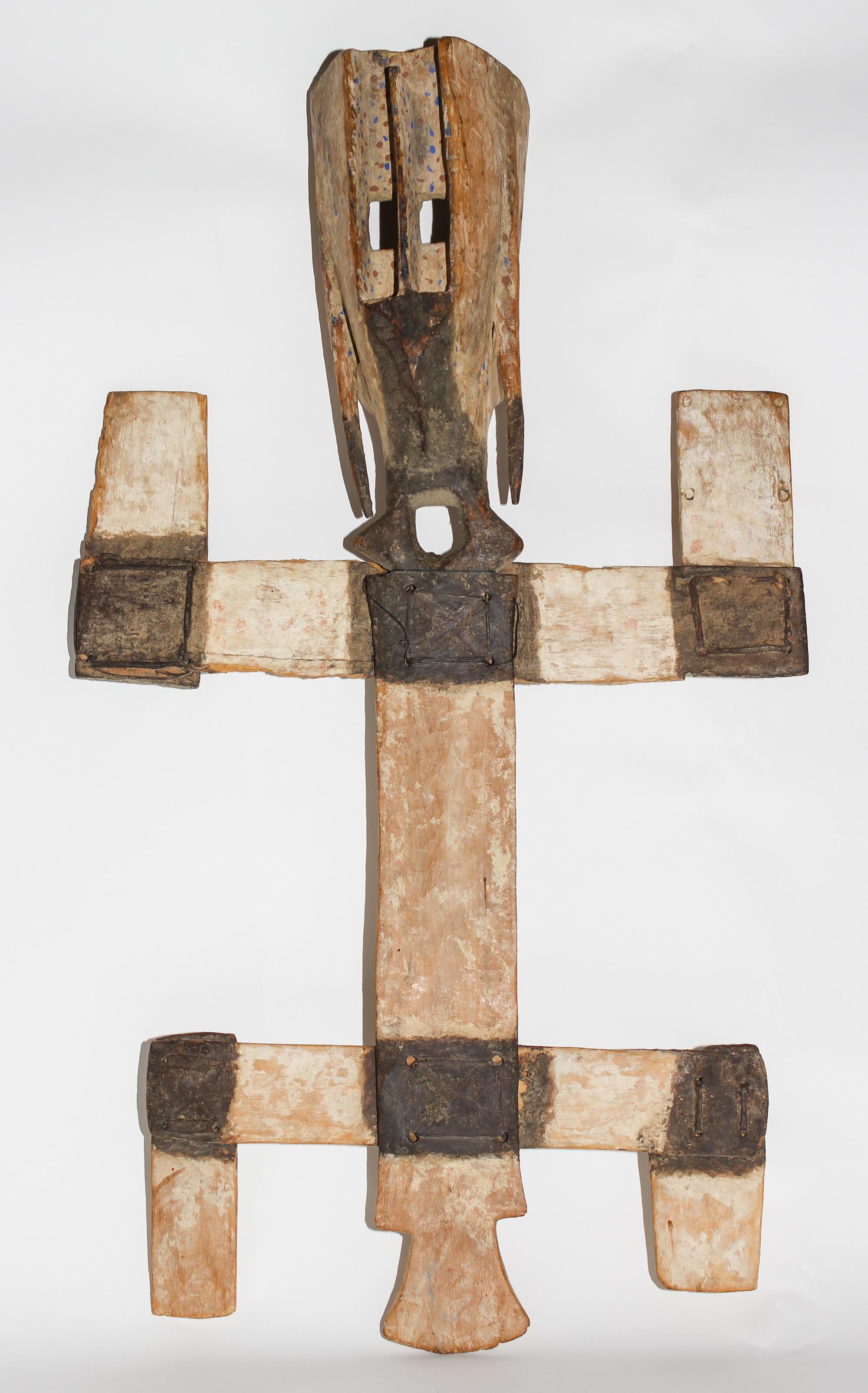 A Dogon Painted Kanaga Mask. Height 36 inches.