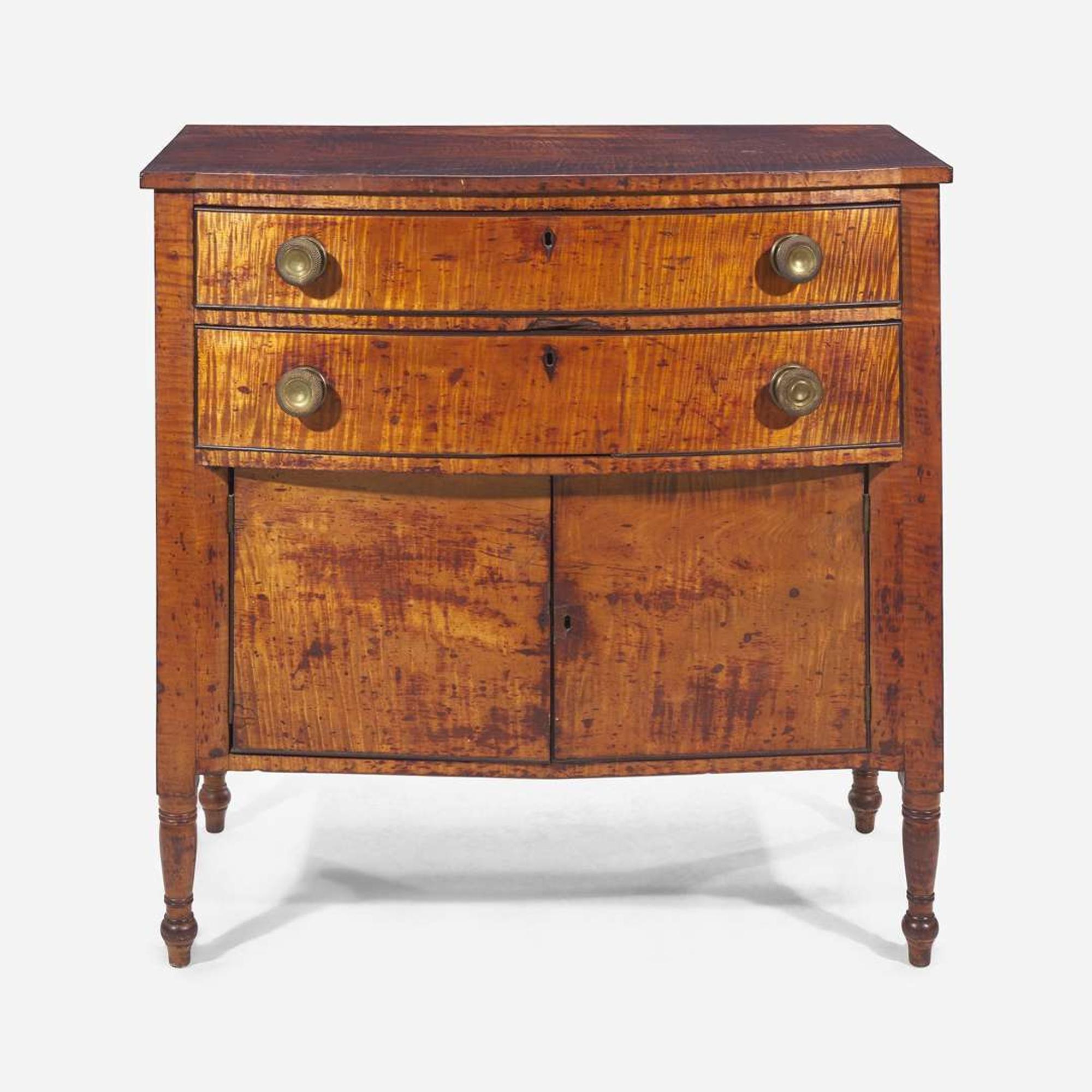 A Federal carved tiger maple bowfront dressing table together with tiger maple mirror early 19th century