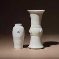 Two Chinese Blanc-de-Chine Porcelain Vases, 17th-18th Century — 清中期 德化白瓷雙輔首耳筒瓶及花觚