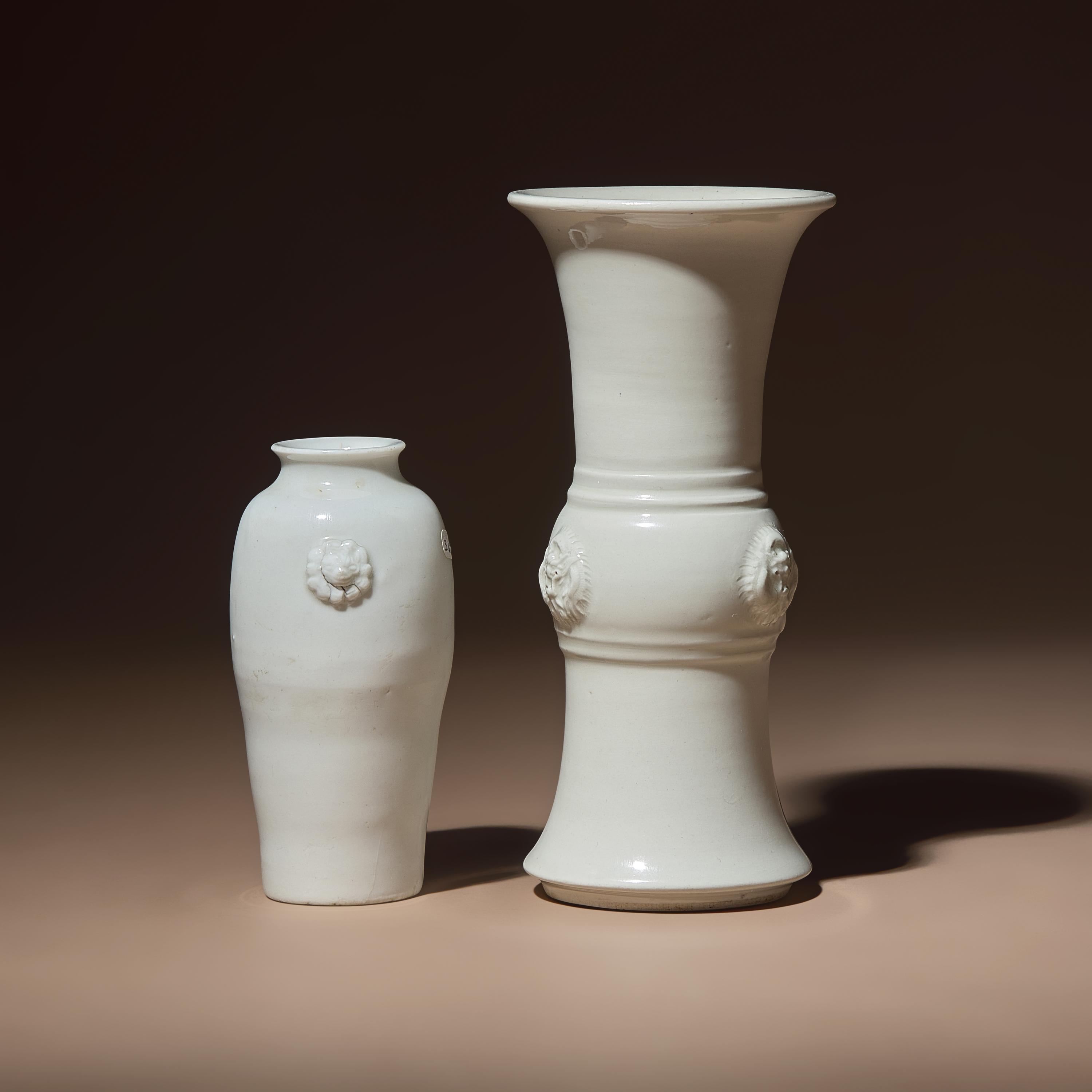 Two Chinese Blanc-de-Chine Porcelain Vases, 17th-18th Century — 清中期 德化白瓷雙輔首耳筒瓶及花觚