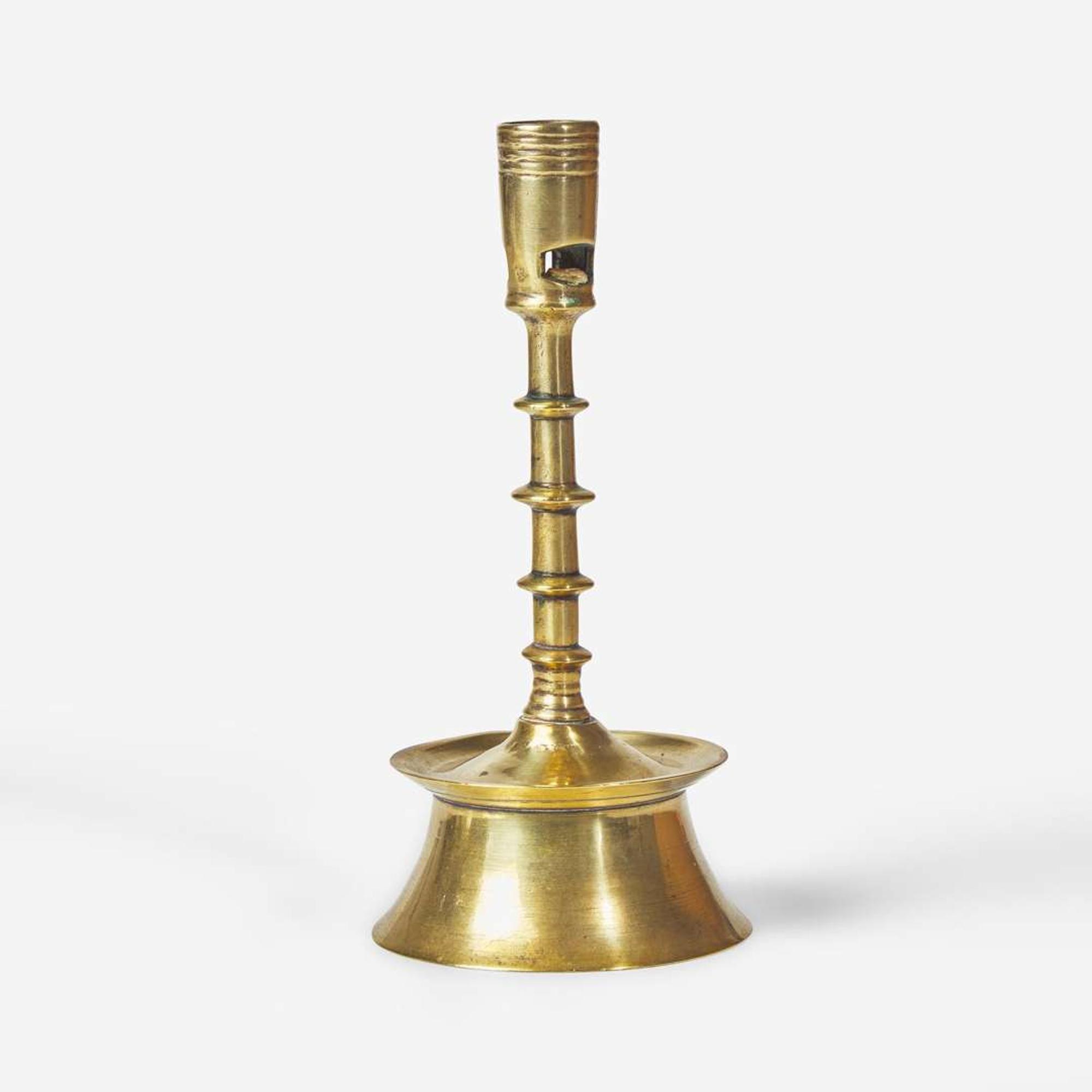A Flemish brass candlestick 15th / 16th century