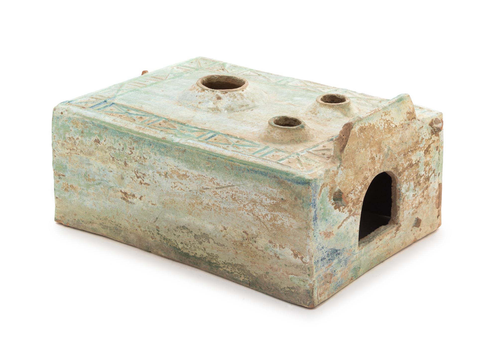 A Large Chinese Green Glazed Pottery Model of a Stove Length 13 1/2 x width 9 1/2 x height 5 1/4 inches. — HAN DYNASTY (206 B.C. - A.D. 220)