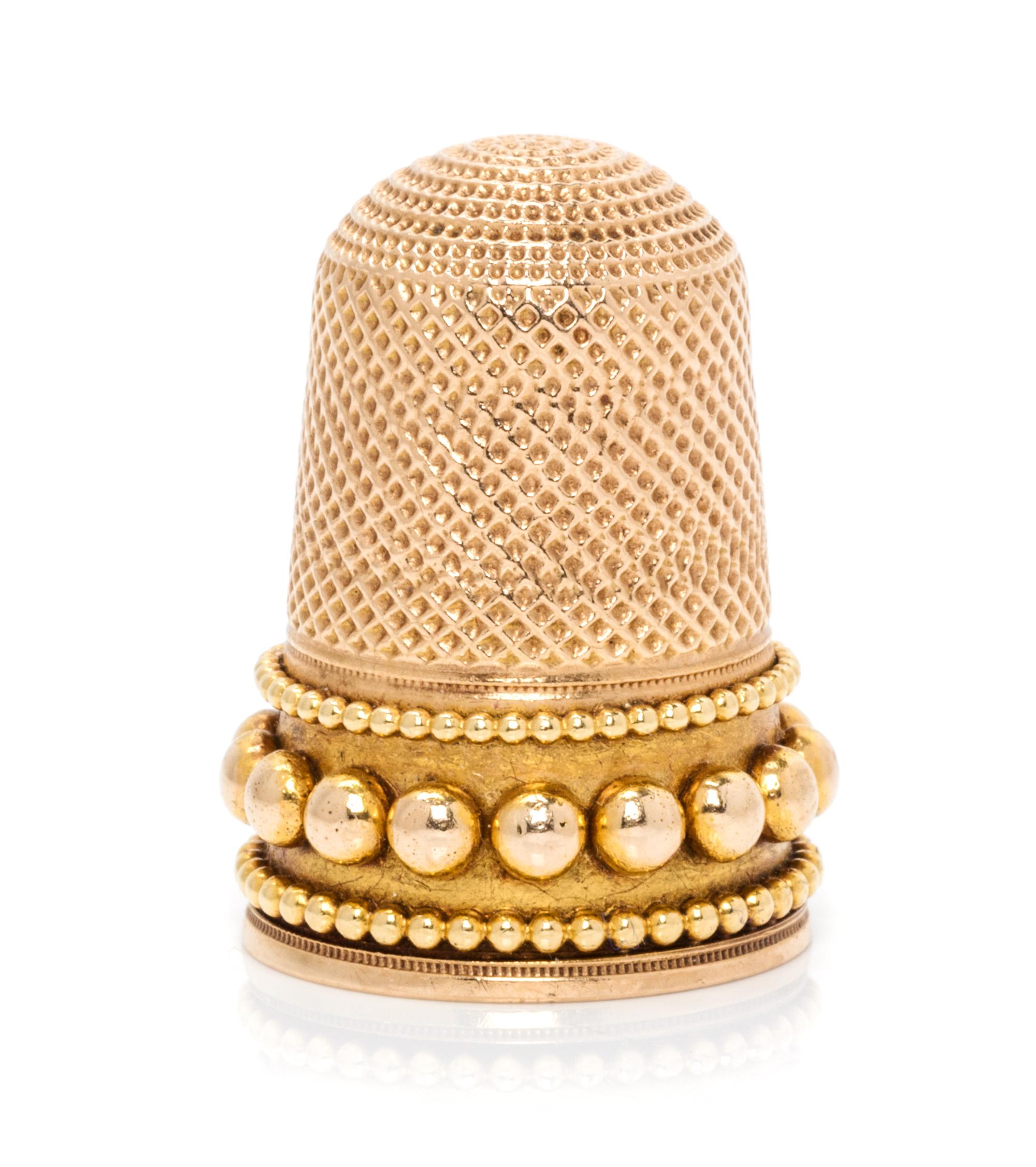 A George III Style Yellow Gold Thimble, , the knurled top and body above three beaded bands.