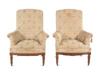 A Pair of Louis XVI Style Walnut Easy Chairs