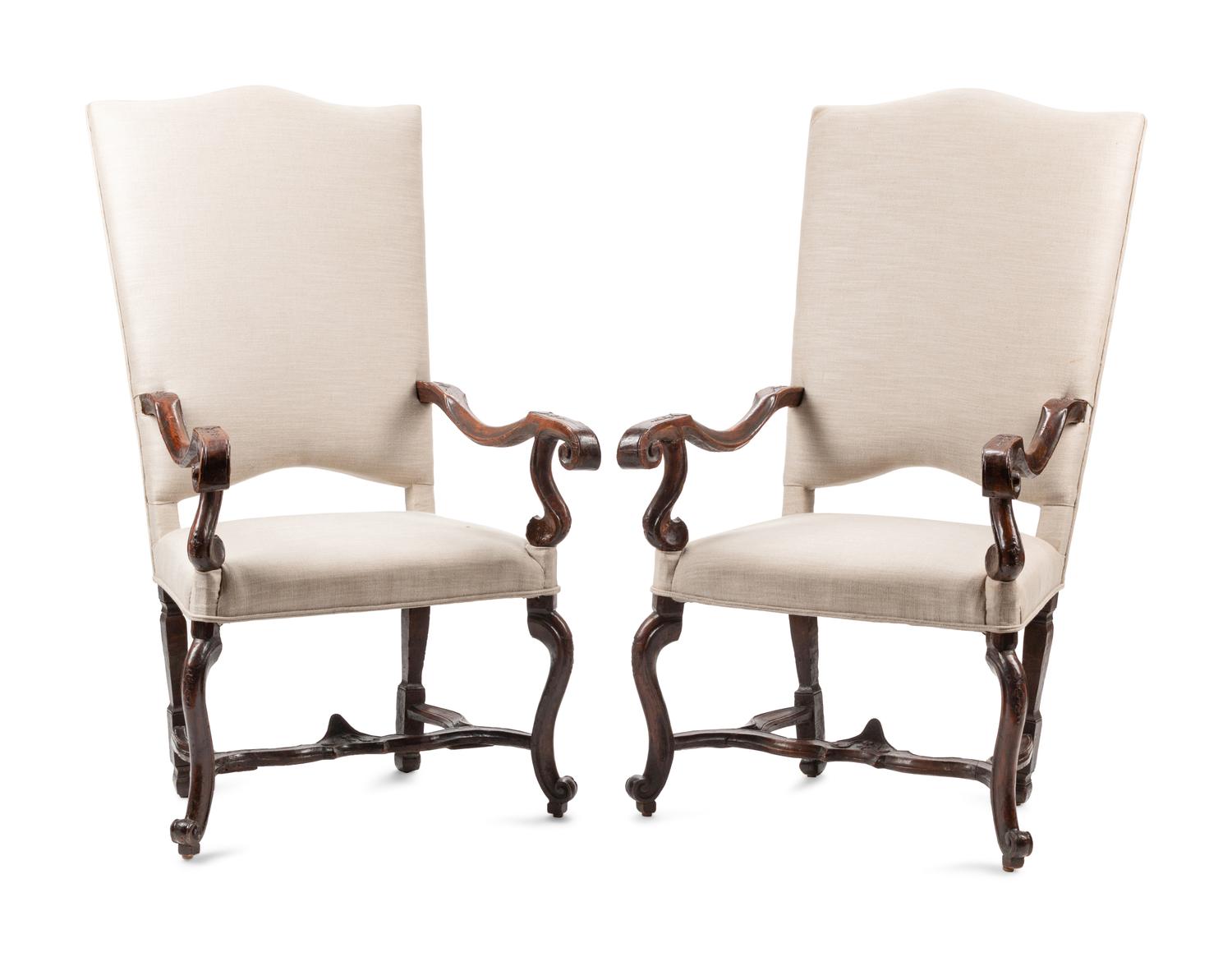 A Pair of Régence Carved Walnut Fauteuils