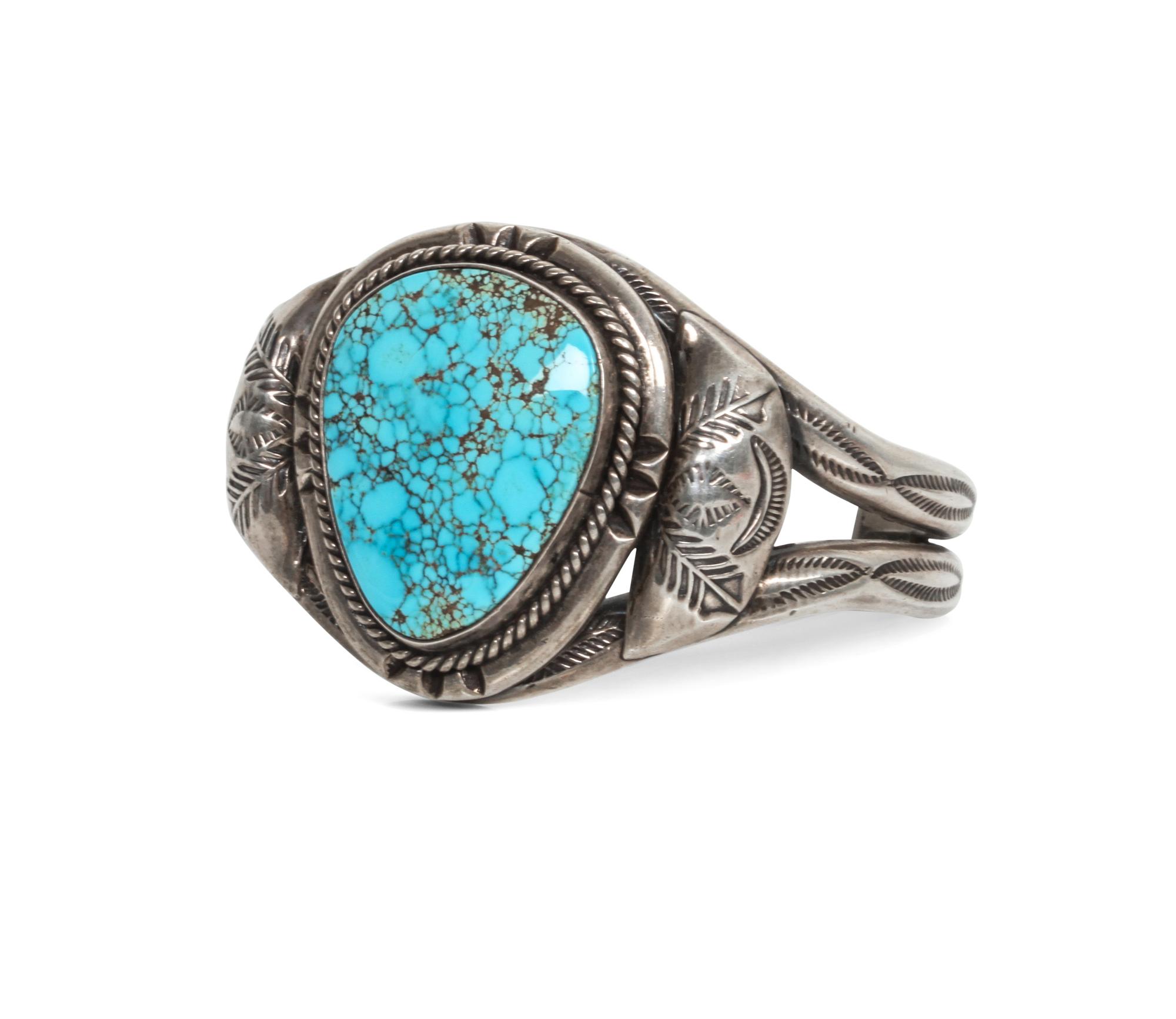 A Navajo Silver and Turquoise Bracelet Length 5 1/4 x opening 1 1/8 x width 1 1/2 inches.