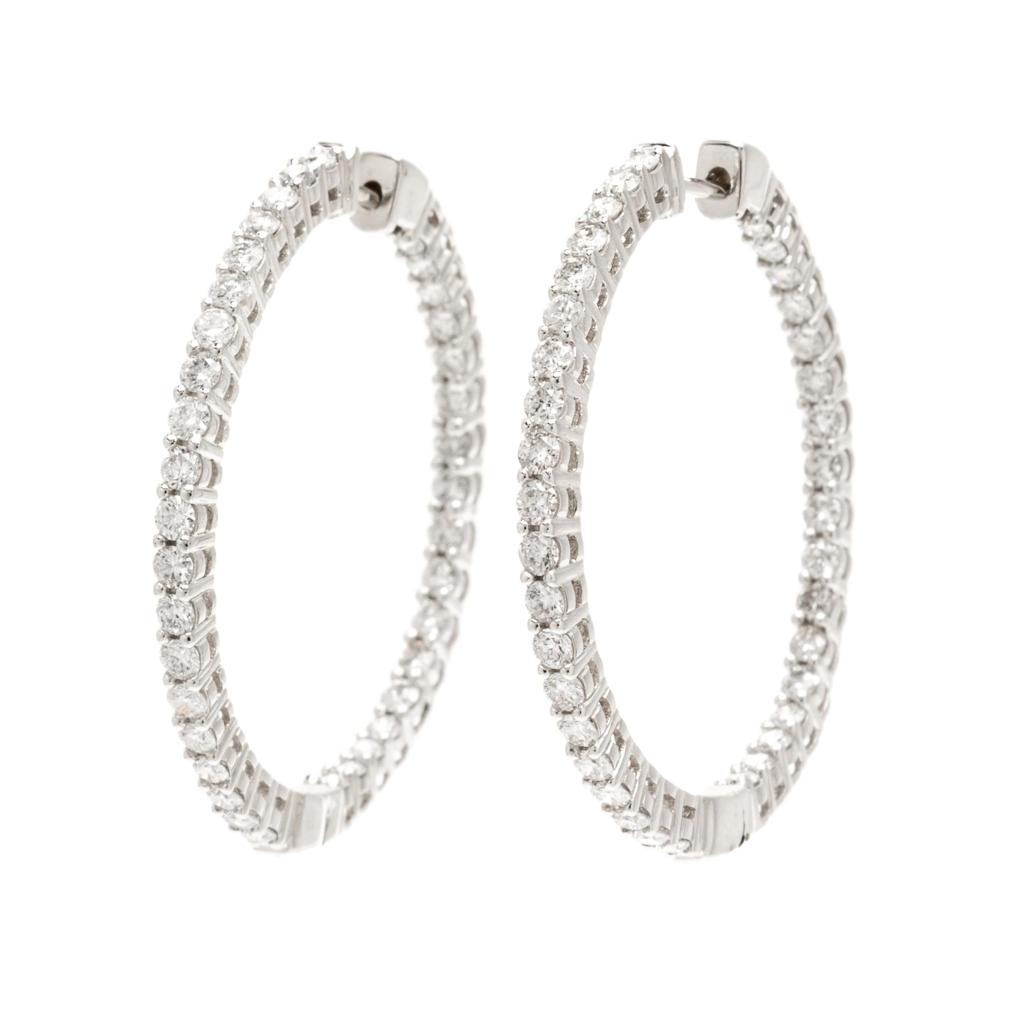 A Pair Of 14 Karat White Gold and Diamond Hoop Earrings, 4.20 dwts.