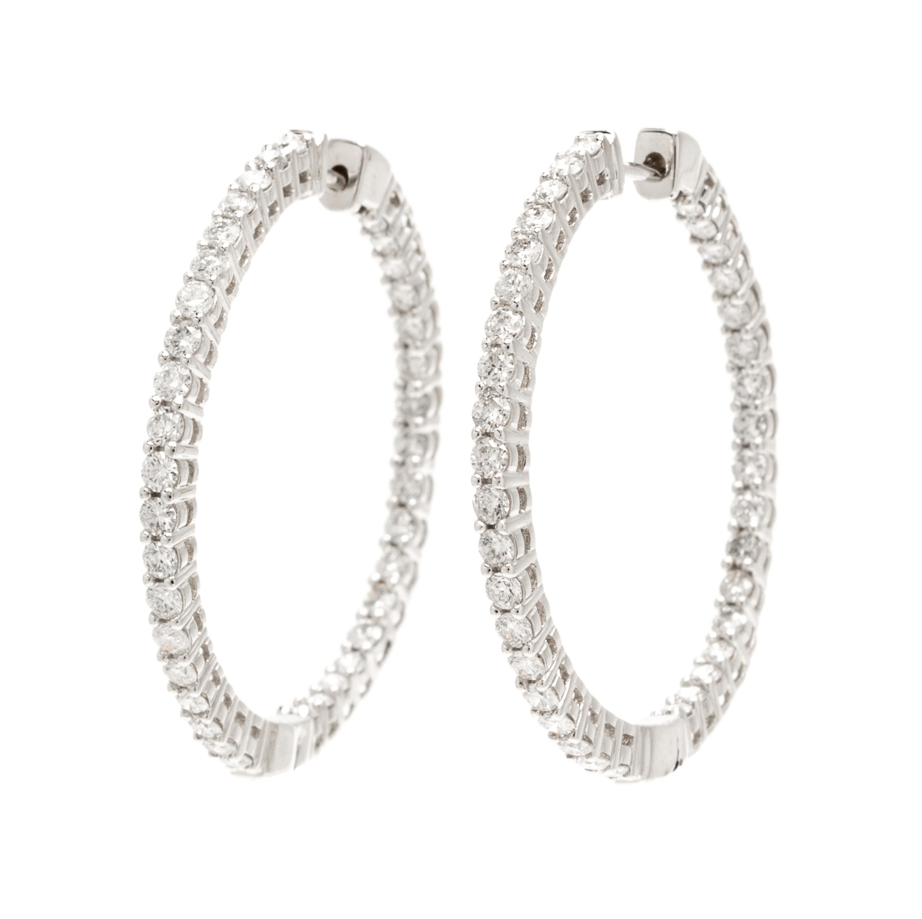 A Pair Of 14 Karat White Gold and Diamond Hoop Earrings, 4.20 dwts.