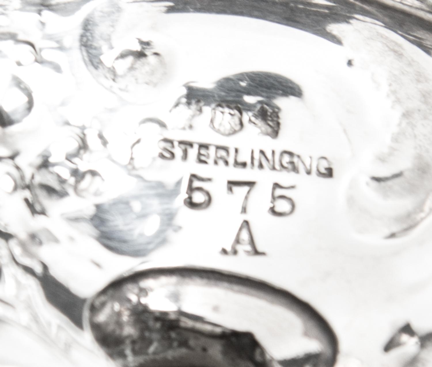 Two Pairs of Silver Casters, , comprising an Edwardian cylindrical pair, Harrison Bros. & Howson, Sheffield, 1902 and an American balus