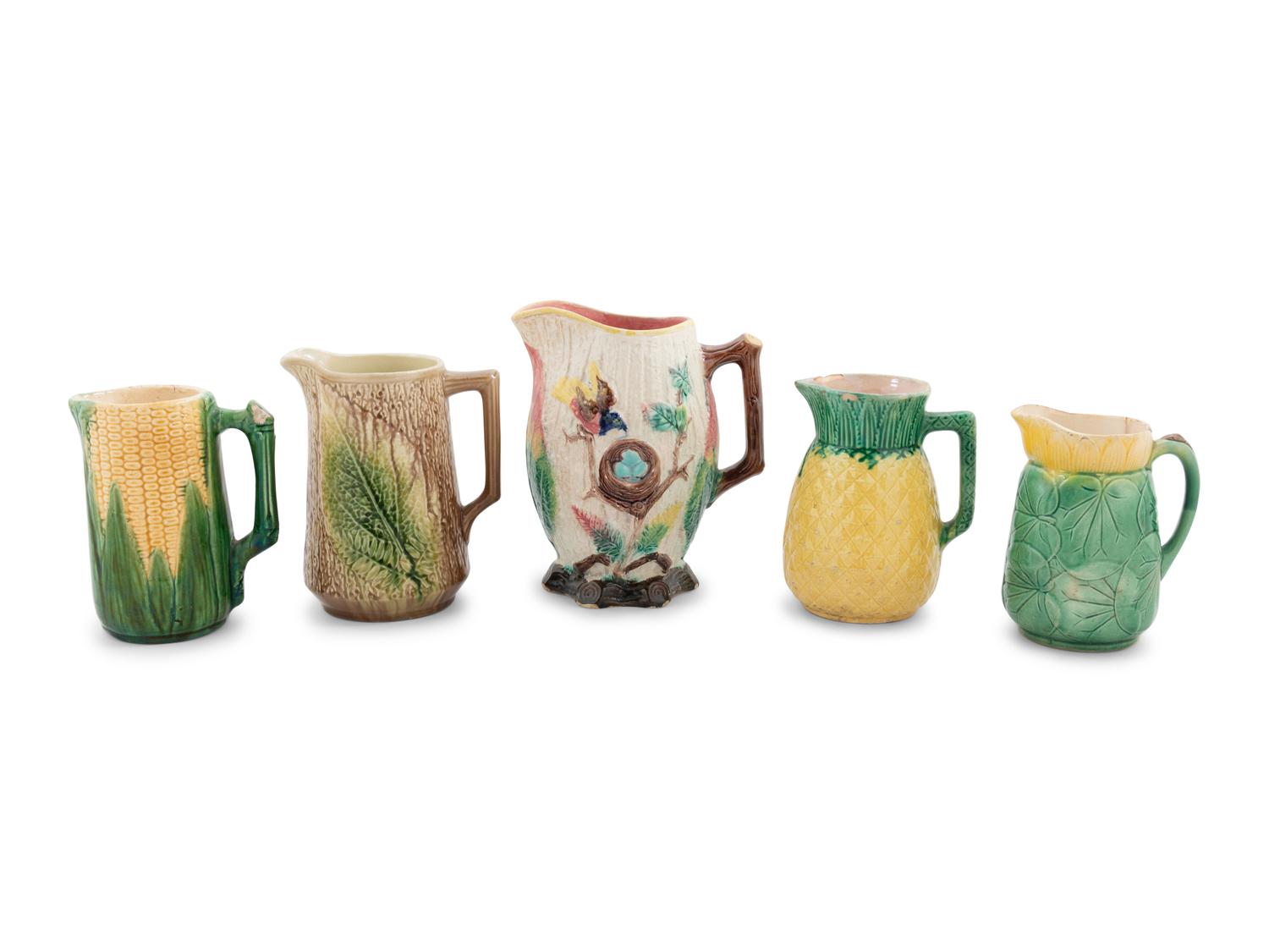 A Group of Nine Majolica Pitchers