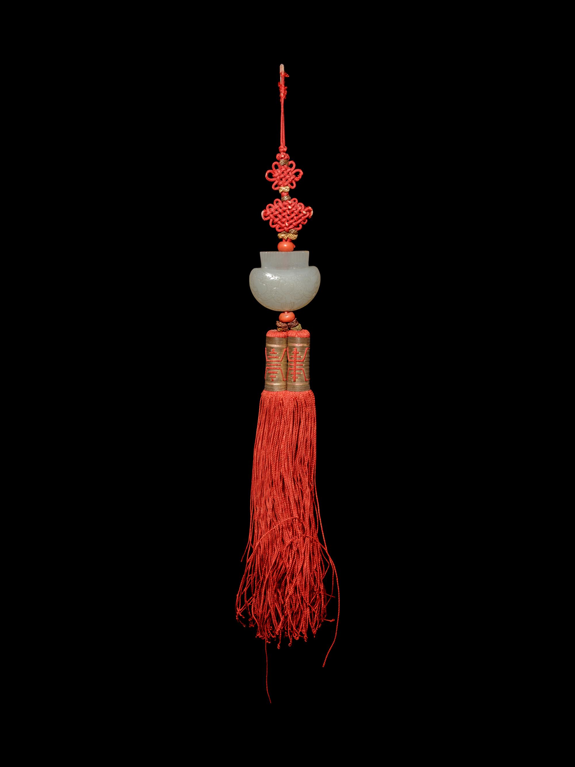 A White Jade Purse-Form Pendant