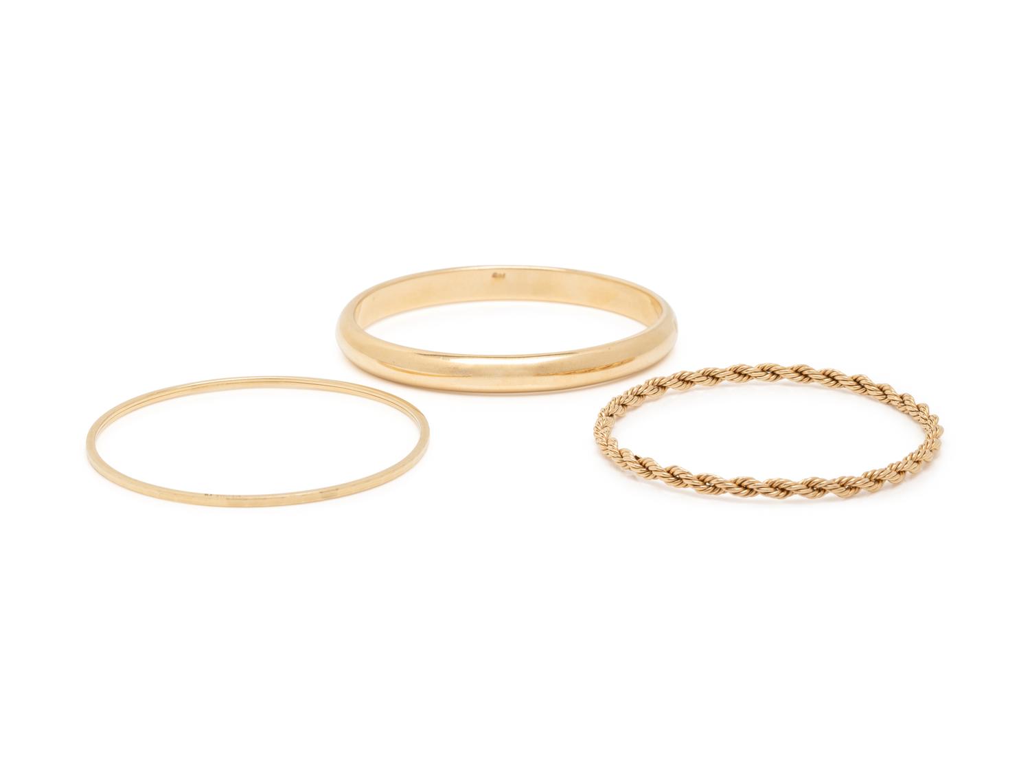 COLLECTION OF YELLOW GOLD BANGLE BRACELETS