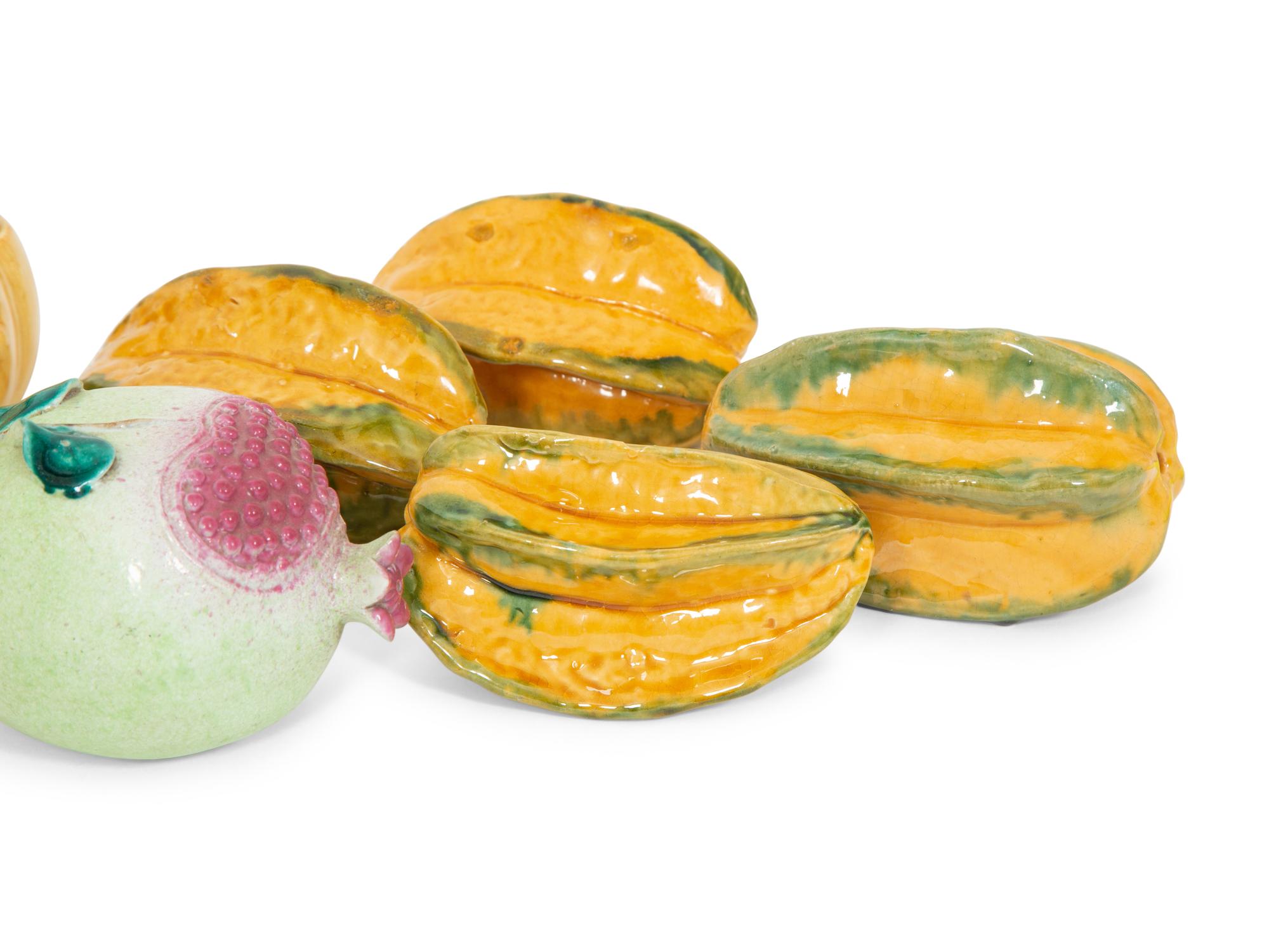 A Collection of Fifteen Miscellaneous Glazed Ceramic Fruits and Vegetables