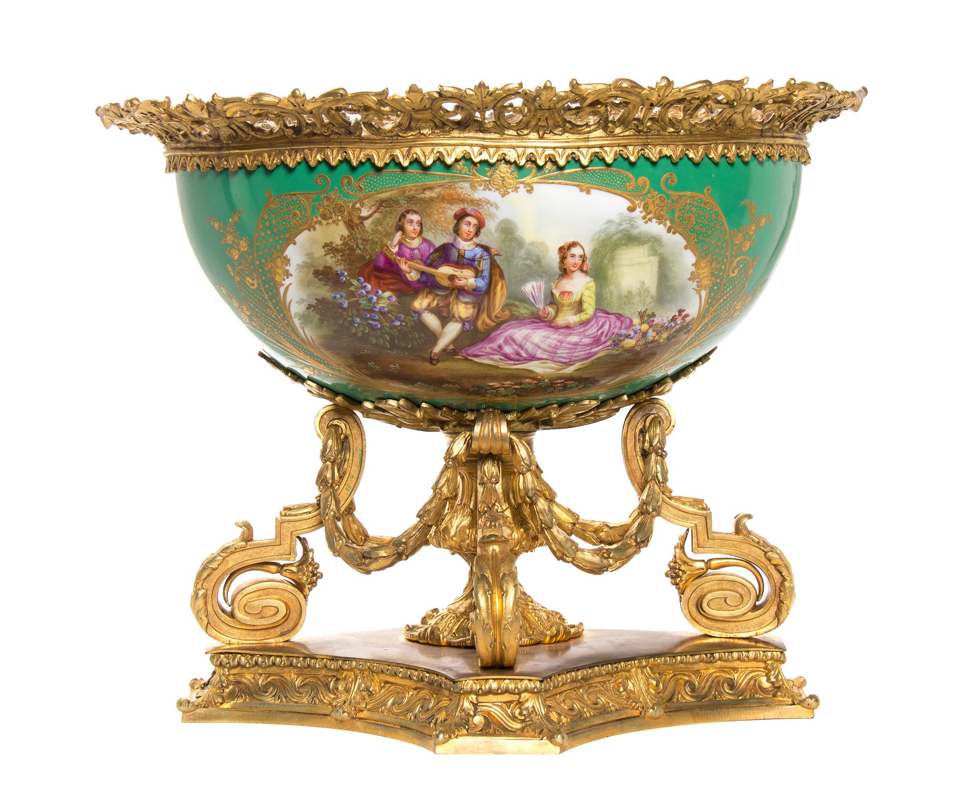 A Louis XVI Style Porcelain and Gilt Bronze Mounted Center Bowl, Width overall 19 inches.