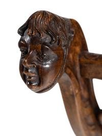 An Italian Renaissance Revival Carved Walnut Curule Bench
