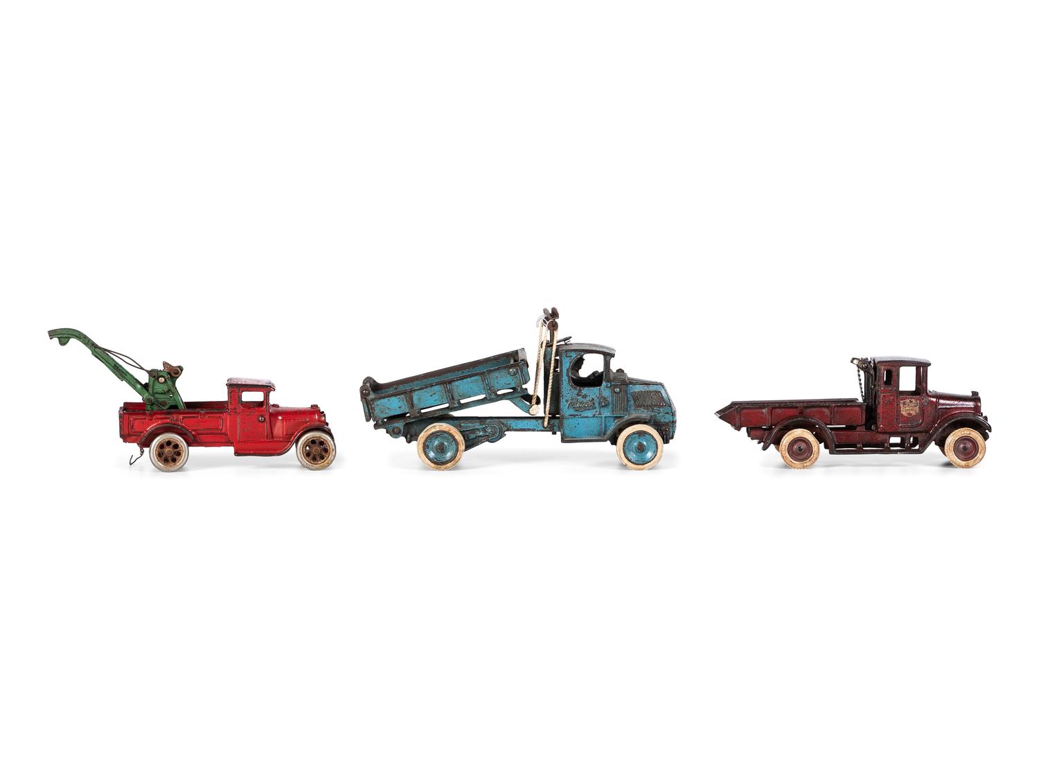 Three Arcade Painted Cast Iron Toy Trucks
