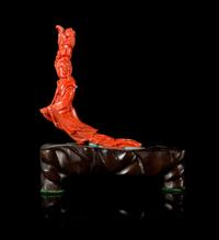 A Carved Red Coral Figure of a Female Immortal Height 4 1/4 inches.
