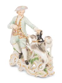 A Meissen Porcelain Figural Group of a Man with Hounds