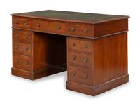 A George IV Walnut Kneehole Desk with Green Leather Inset Top