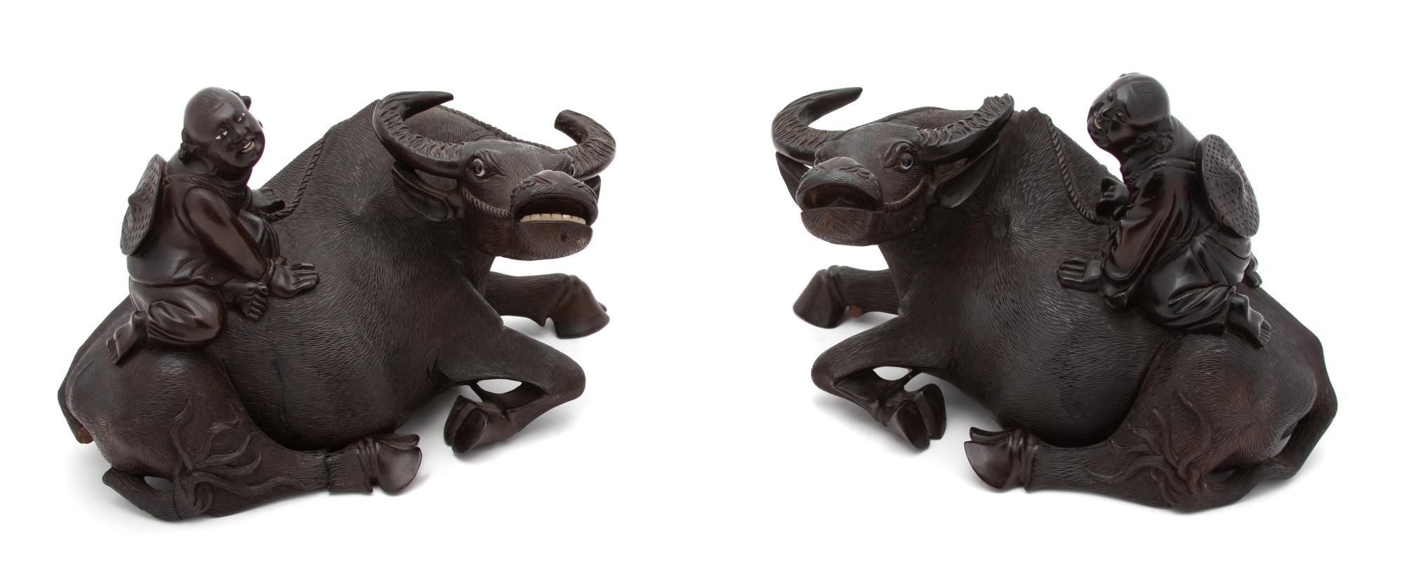 A Pair of Chinese Carved Wood Sculpture of a Boy Riding on a Water Buffalo.
