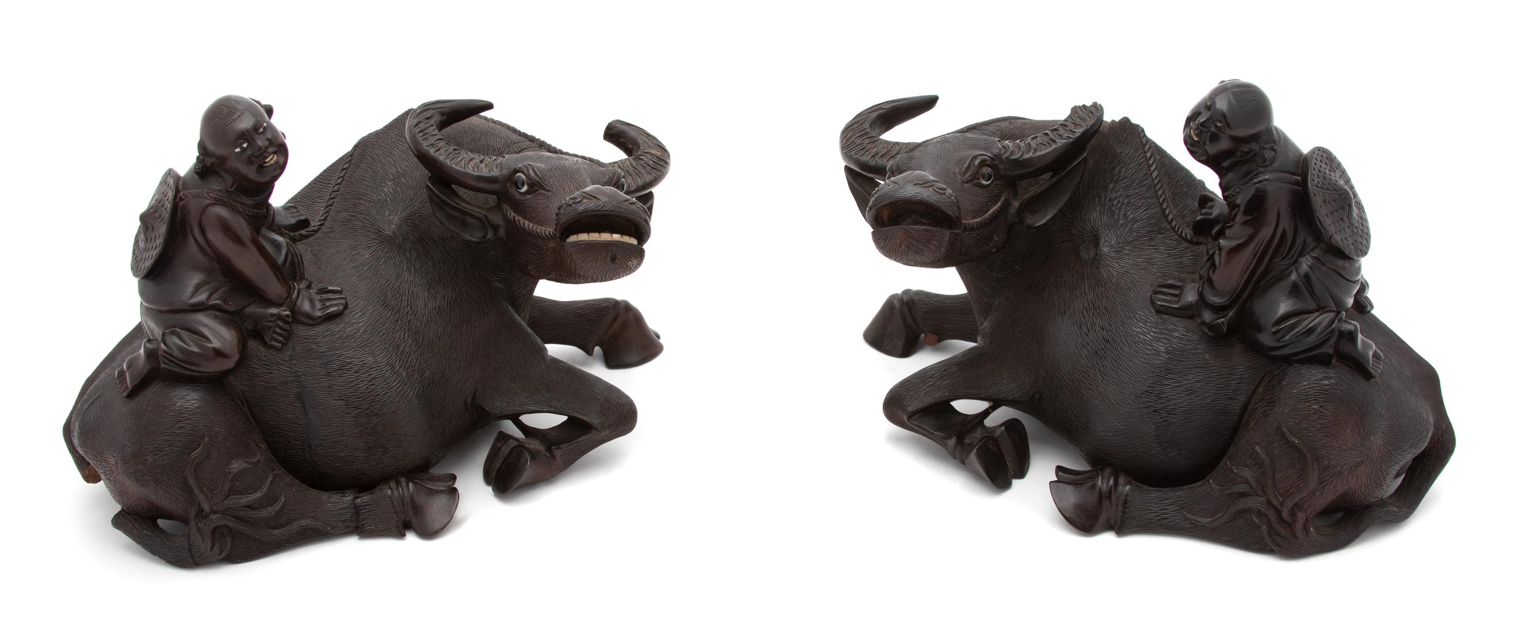 A Pair of Chinese Carved Wood Sculpture of a Boy Riding on a Water Buffalo.