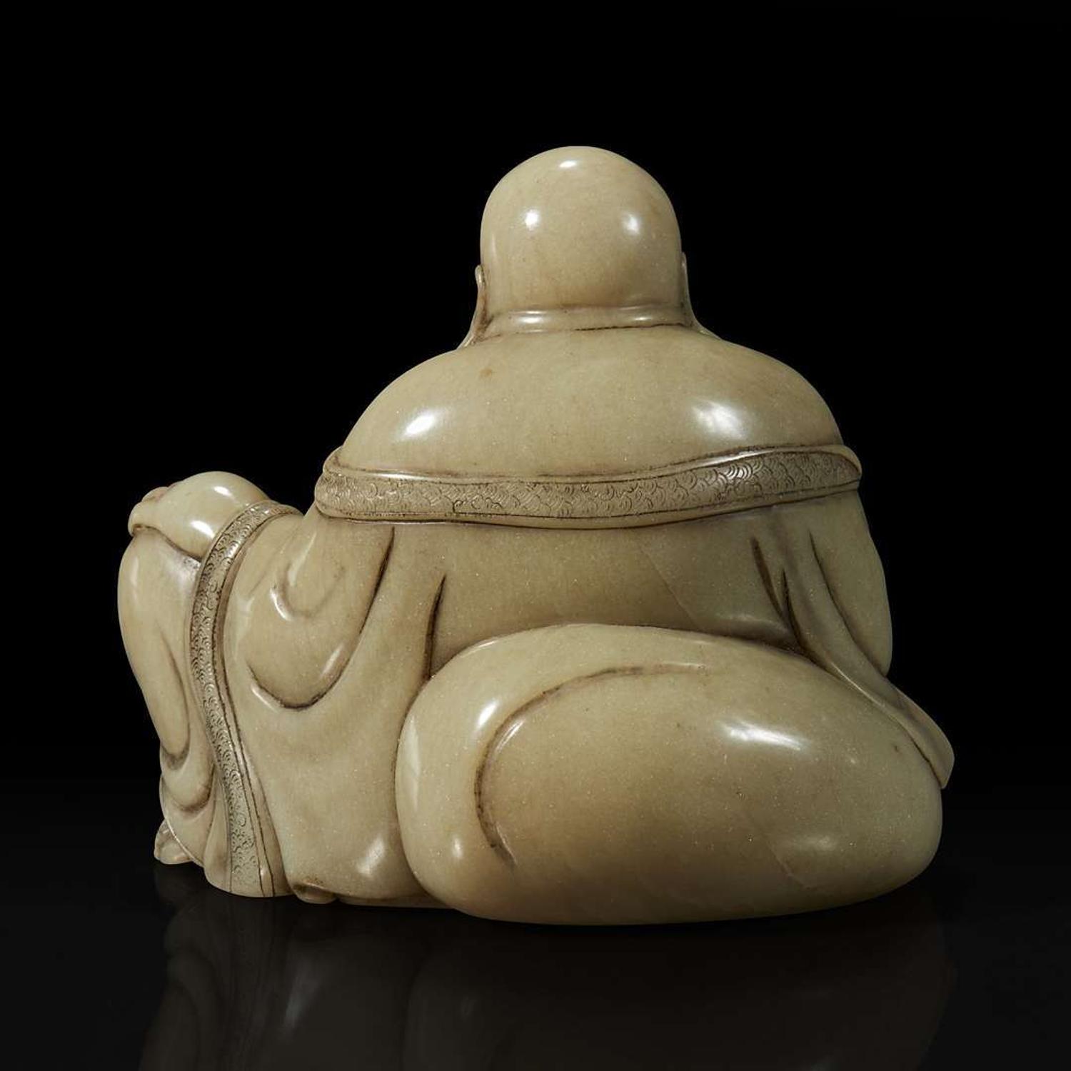 A Chinese carved soapstone figure of a seated Budai 寿山石雕布袋和尚