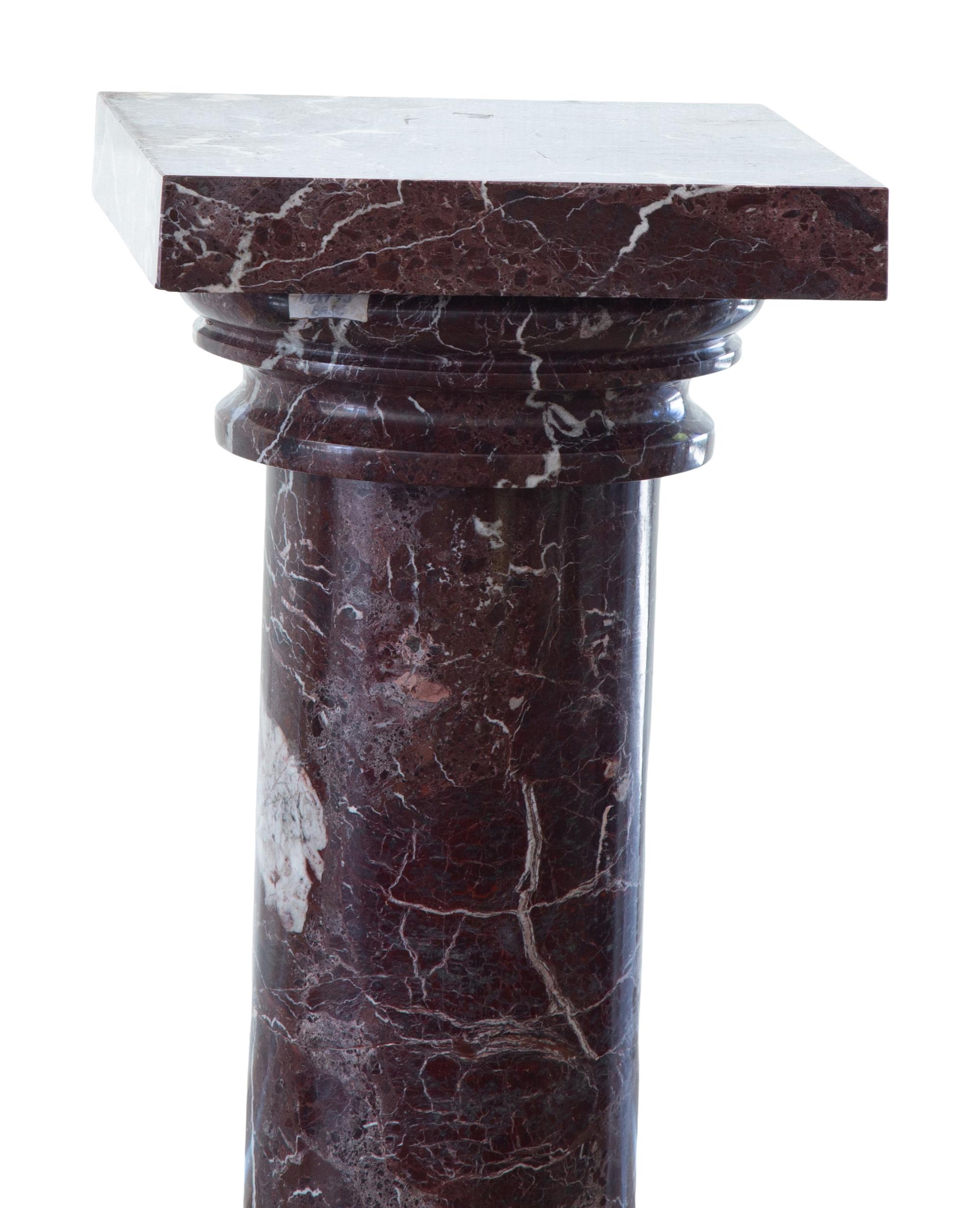 A Pair of Rouge Marble Pedestals