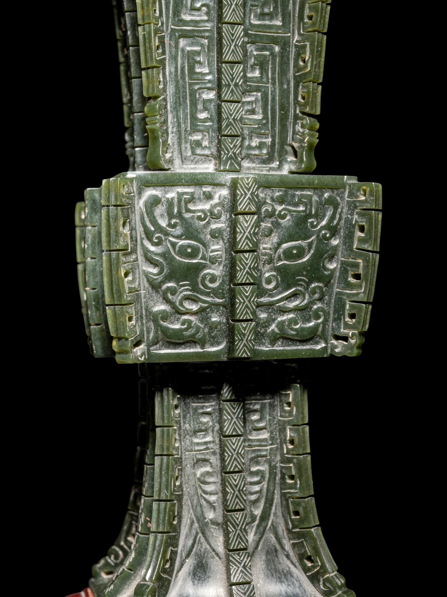A Pair of Spinach Jade 'Taotie' Gu Vases