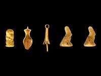 Five Egyptian Gold Amulets including Papyrus, Nefer, Bes and Horus